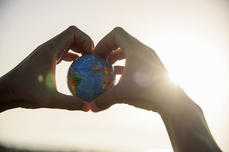 man with a world globe in his hands