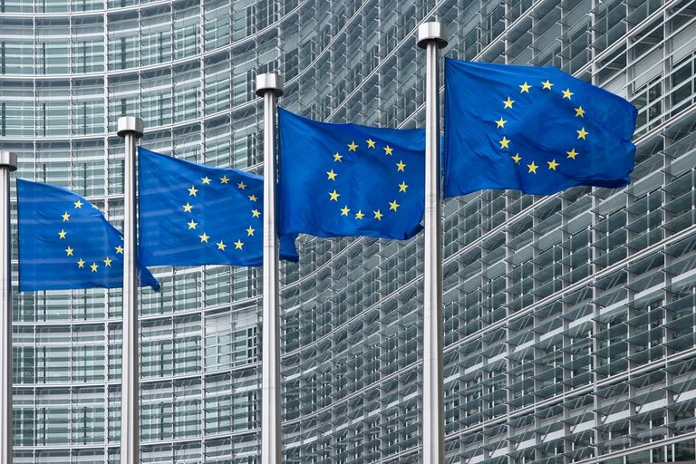 EU flags in front of European Commission in Brussels