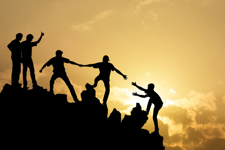 Team of people work on peak mountain climbing 