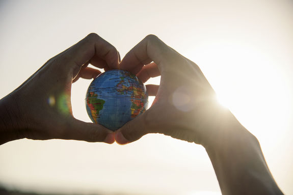 man with a world globe in his hands