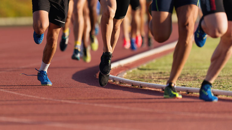 Athletics people running on the track field Athletics people running on the track field